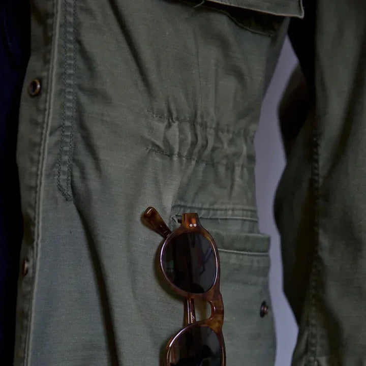 Men's adventure gear: multi-pocket utility long sleeve jacket with adjustable cuffs & waist.