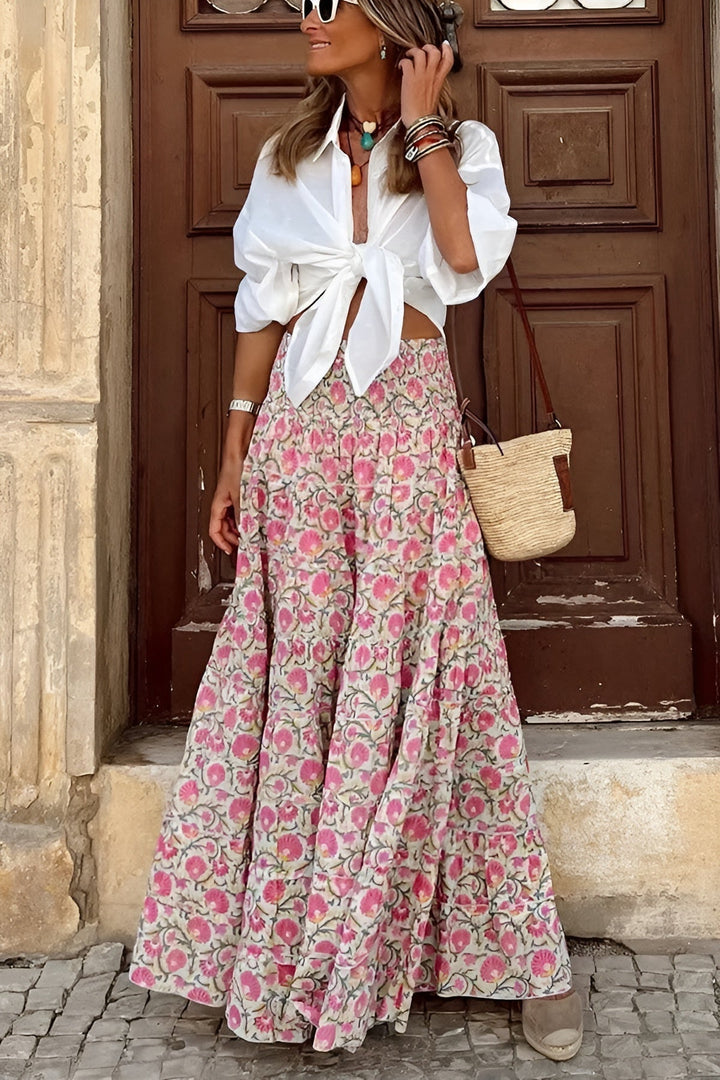 Long tiered floral maxi skirt for women, featuring a comfortable smocked waist and flowy summer style.
