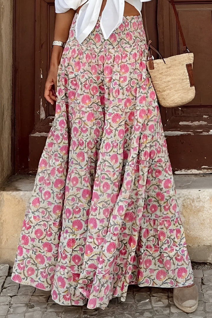 Vibrant floral maxi skirt for women, flowy tiered design & smocked waist, perfect for boho summer fashion.