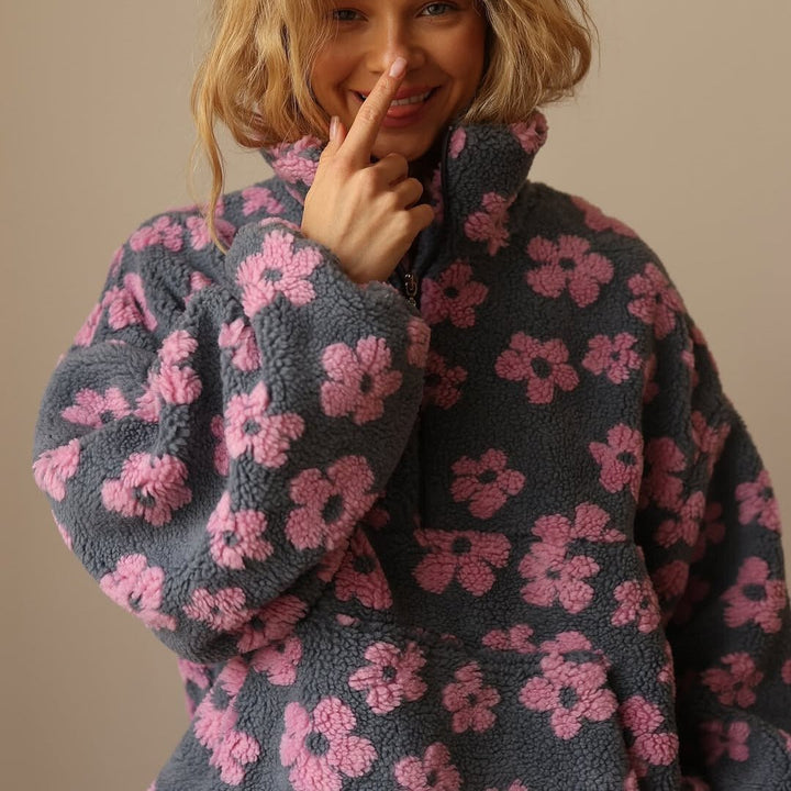 Relaxed fit women's half zip sweater jacket featuring a beautiful floral pattern, great for everyday style.