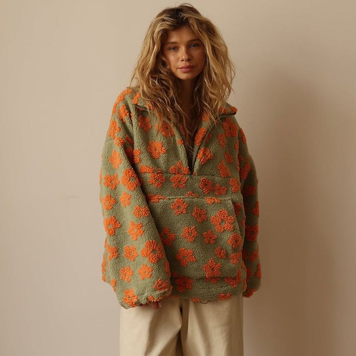 Back view of a women's oversized floral half-zip sweater jacket, emphasizing the relaxed fit.