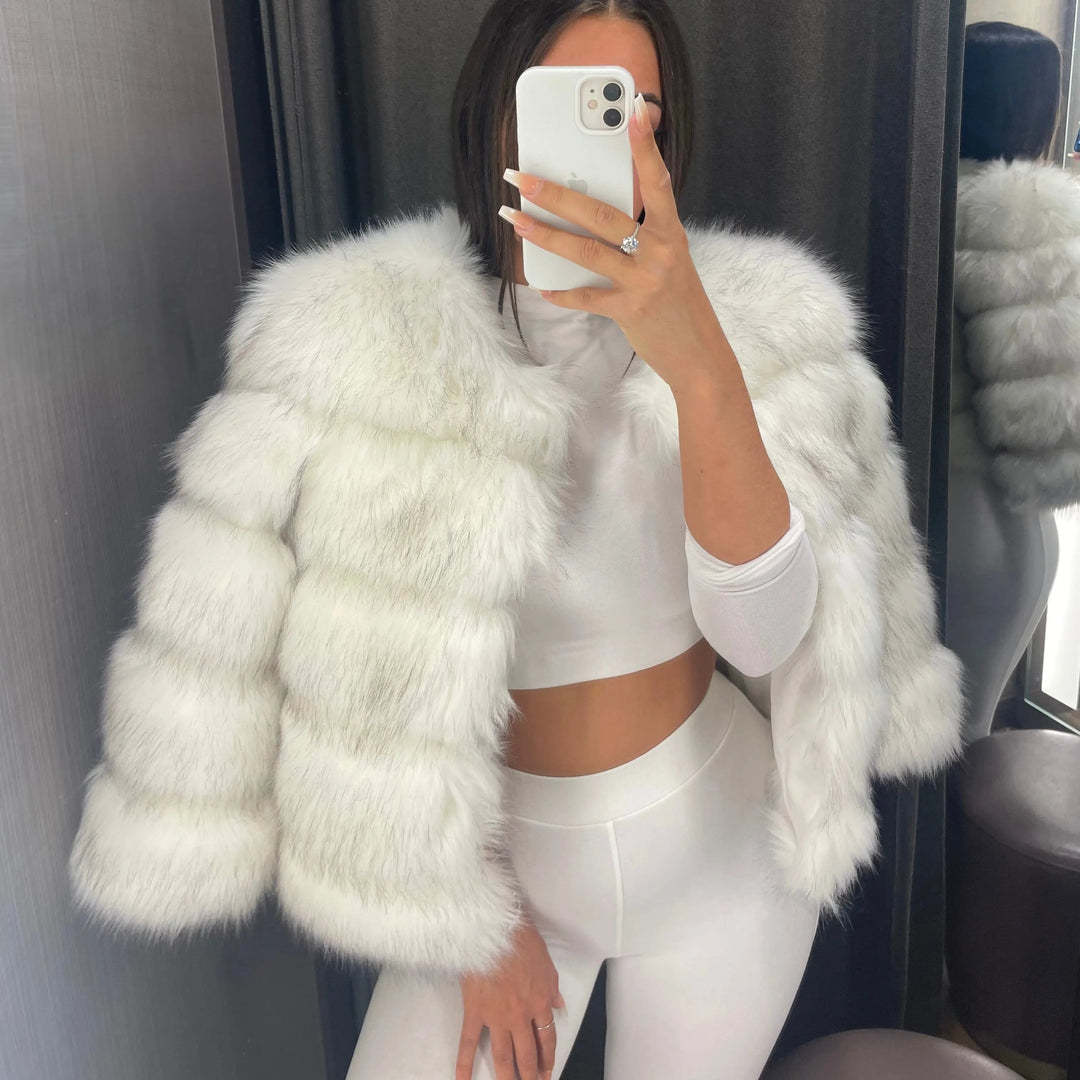 Chic women's winter coat, combining cozy warmth with elegant style for cold weather outerwear.