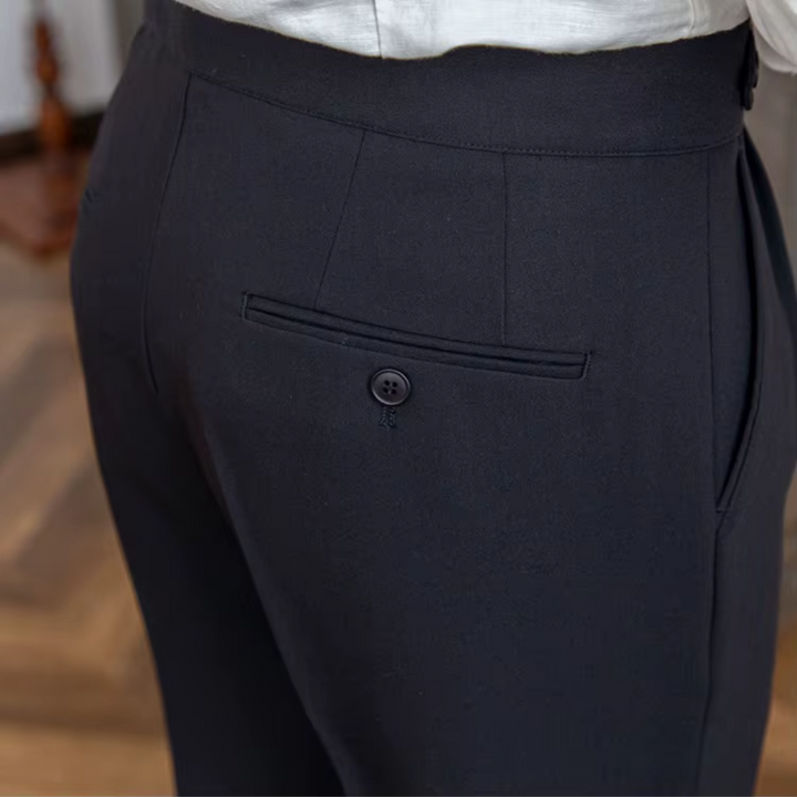 Modern tailored pleated chinos for men, a key piece in contemporary menswear.