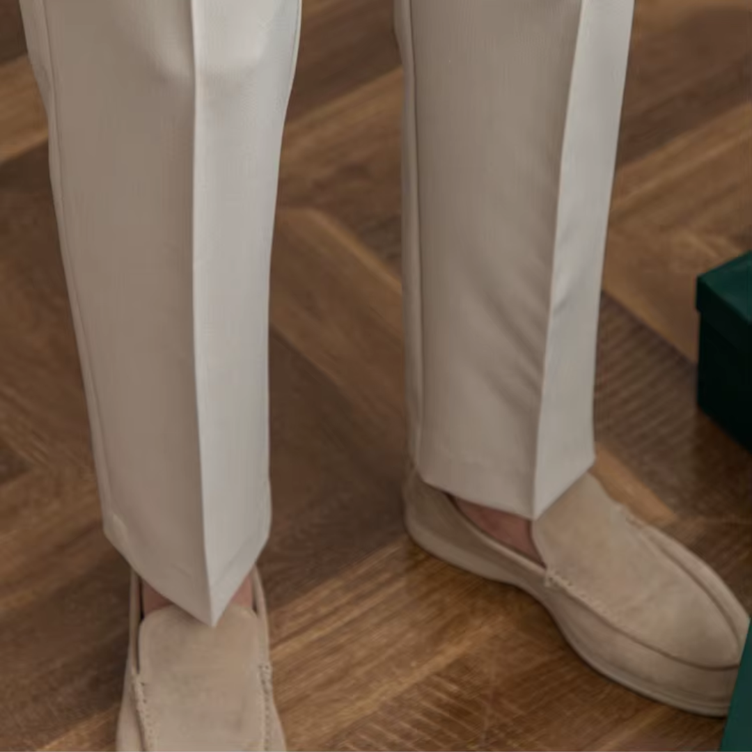 Elegant beige pleated chino trousers for a polished, modern menswear style.