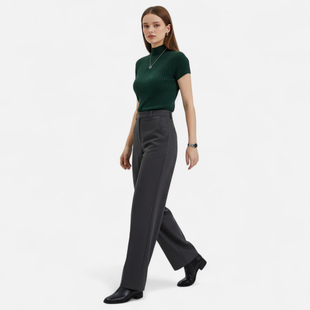 Comfortable & versatile women's short-sleeve knitted turtleneck blouse for casual or dressy looks.