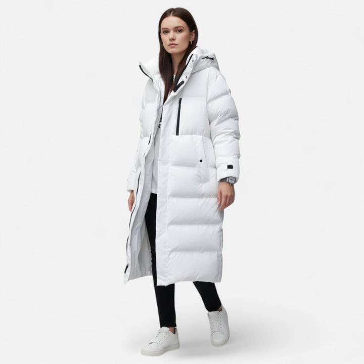 Cozy long puffer winter coat for women. Warm, chic, and stylish outerwear for cold weather fashion.