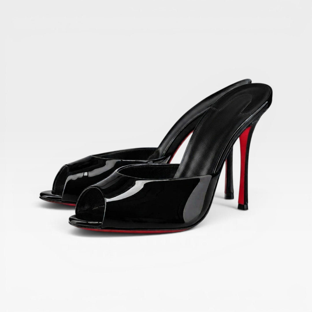 Classic black pointed toe stiletto mules for women, ideal formal footwear for evening and wedding.