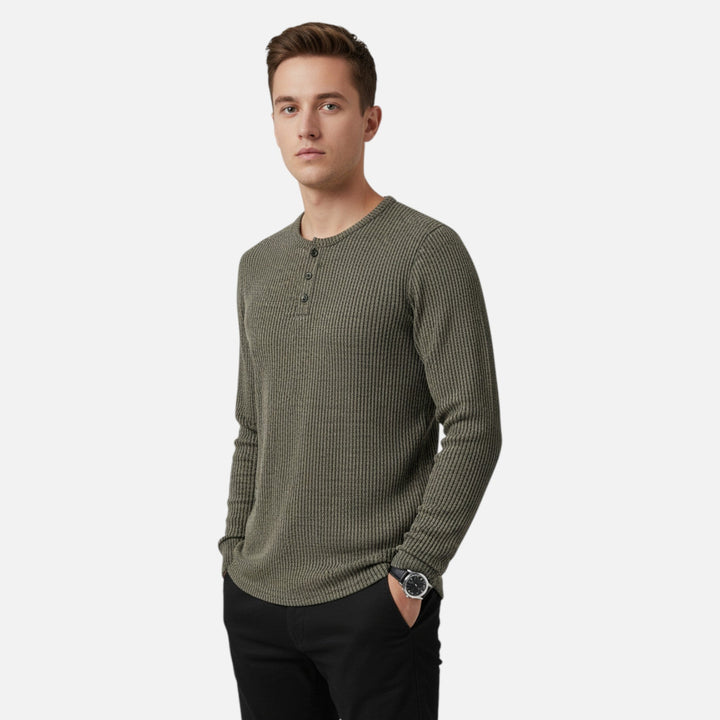 Close-up of men's cable-knit henley sweater texture. Perfect long-sleeve layering piece for spring/autumn.