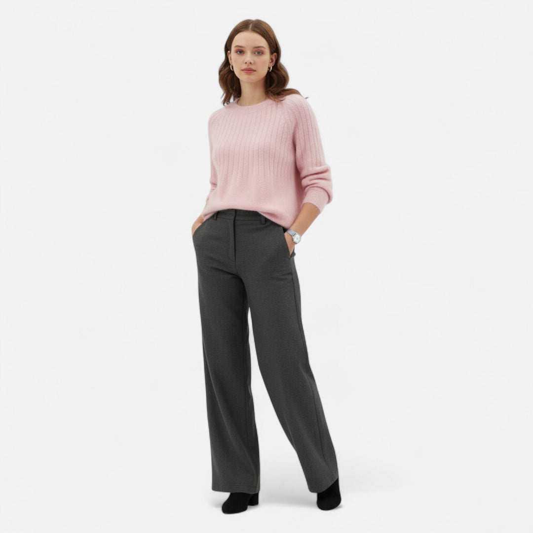Close-up of a soft, chunky knit women's pullover sweater, highlighting its cozy texture and elegant feel.
