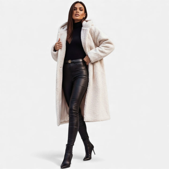 Cozy women's long plush winter coat, chic outerwear for cold weather.