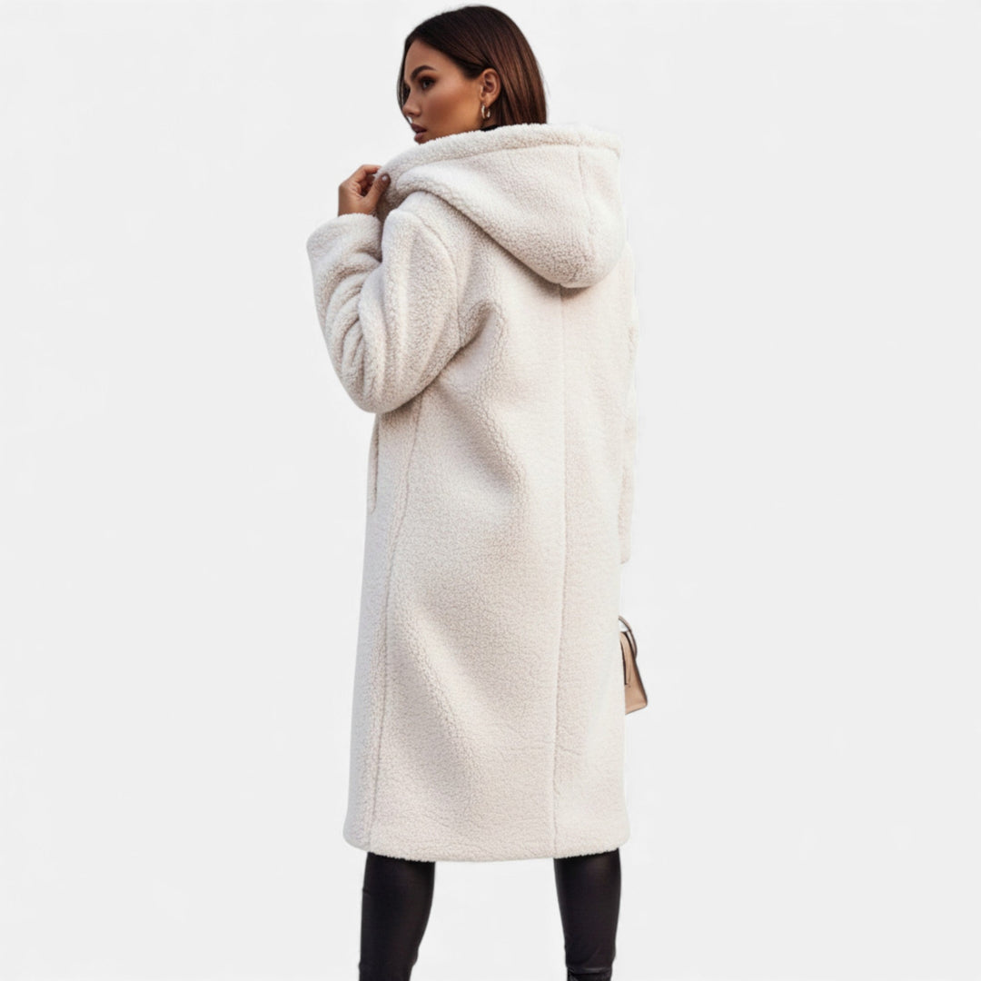 Fashionable women's plush winter coat, long and warm for elegant comfort.
