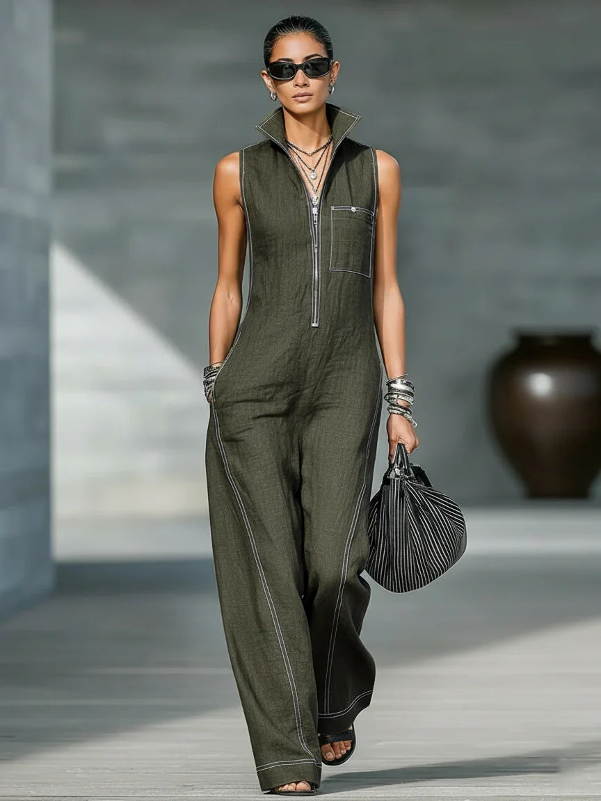 Relaxed fit women's sleeveless jumpsuit, black with contrasting white trim, ideal for casual elegance.