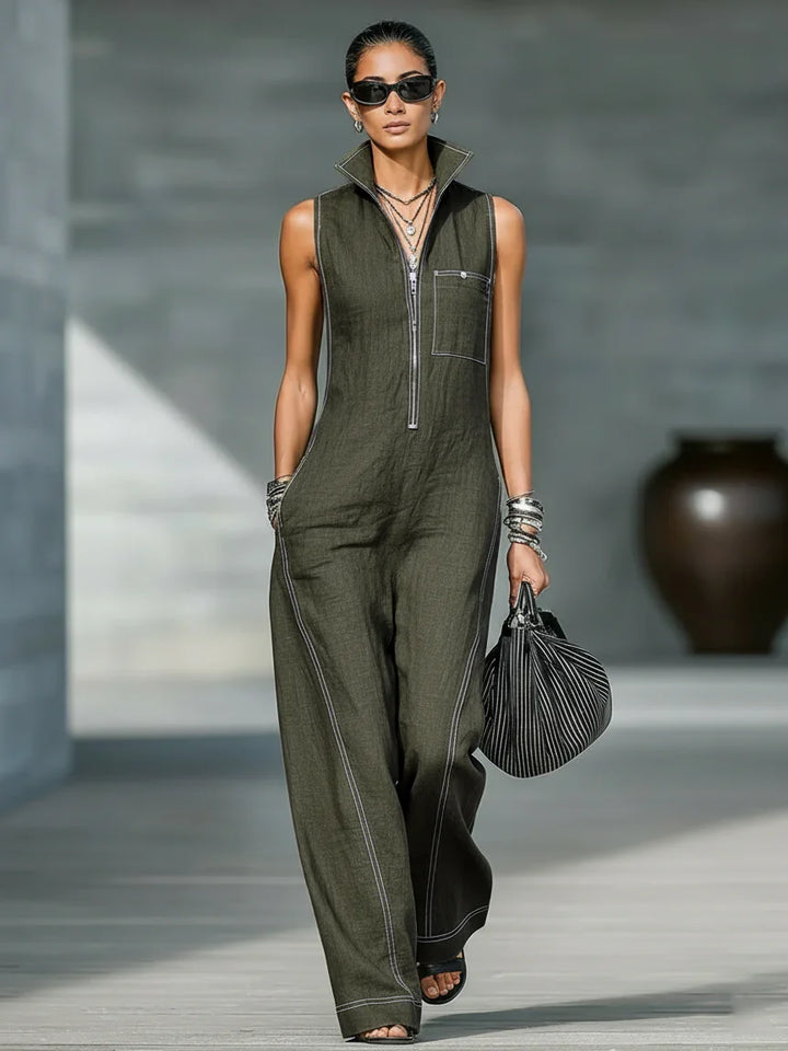 Relaxed fit women's sleeveless jumpsuit, black with contrasting white trim, ideal for casual elegance.