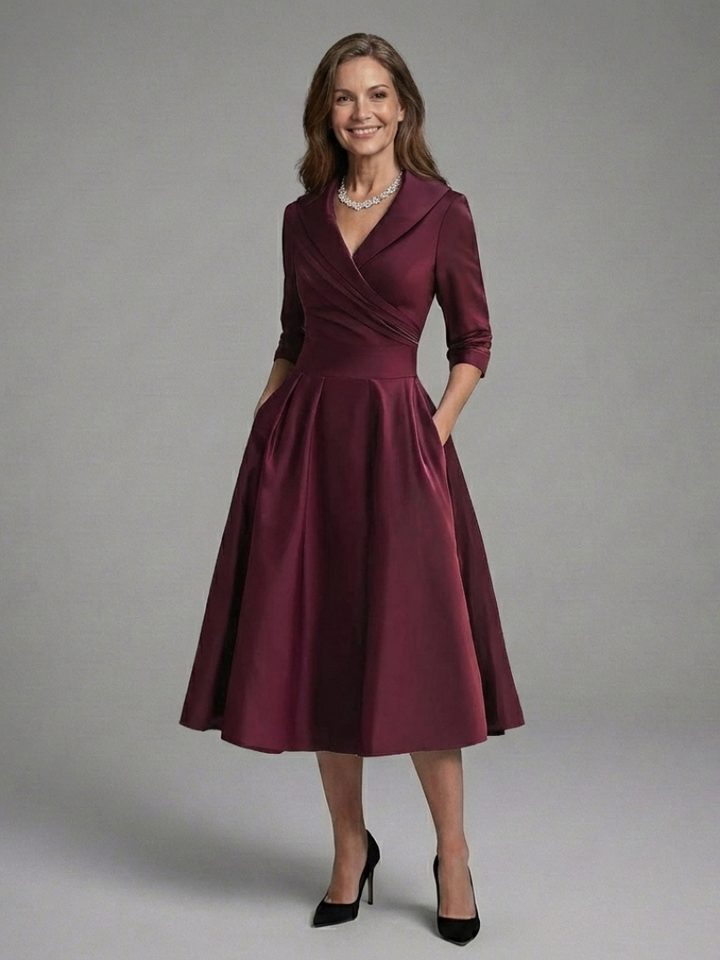 Chic women's three quarter sleeve midi wrap dress. Versatile and elegant for day or evening events.