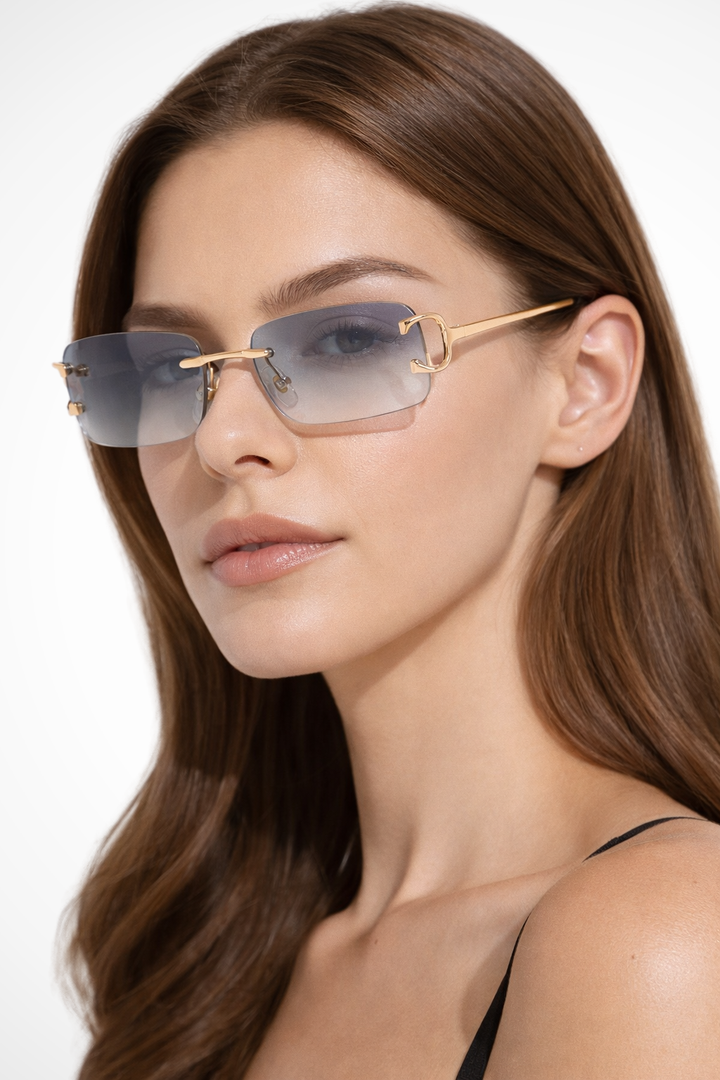 Sophisticated women's rimless rectangle gold frame sunglasses. Tinted lenses for a modern fashion statement.
