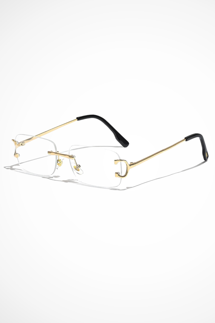 Contemporary women's rimless rectangle sunglasses with tinted lenses & a chic gold frame. Fashion eyewear.