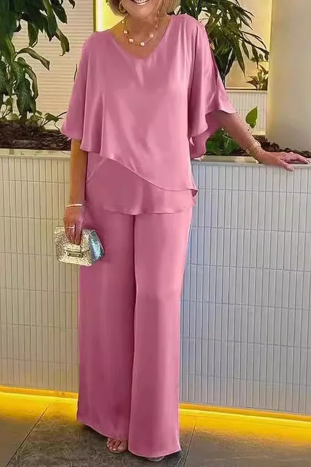 Stylish women's two-piece set with a comfy top & elegant wide leg pants for summer wear.