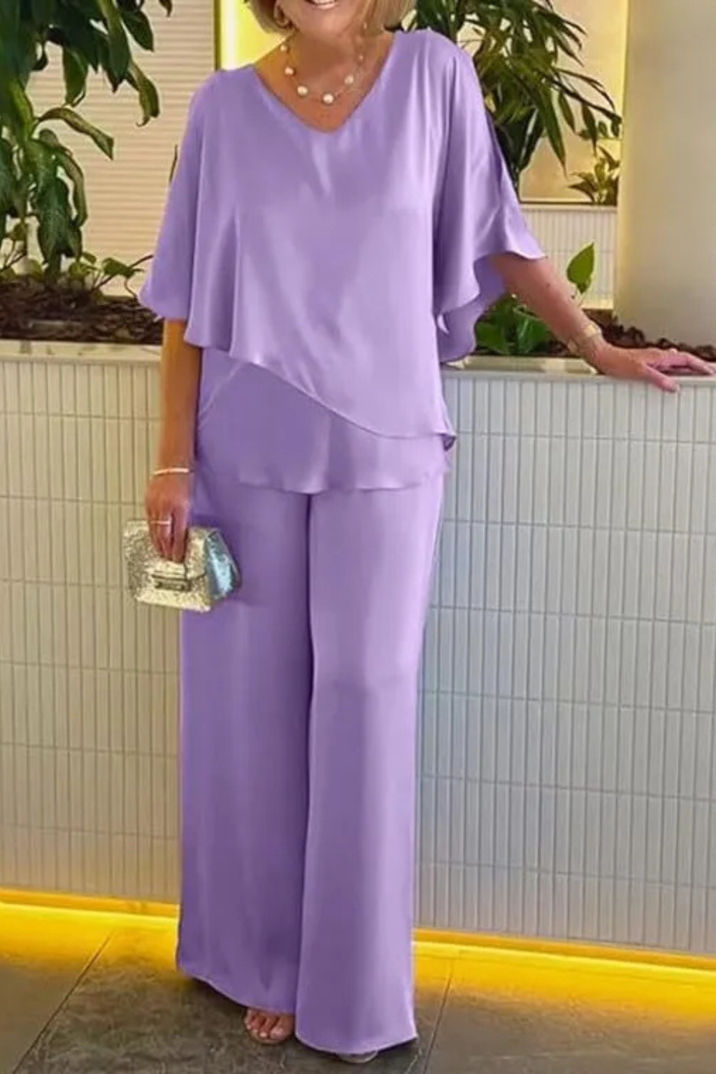 Summer ready women's two-piece set: a chic top & comfortable wide leg pants for versatile styling.