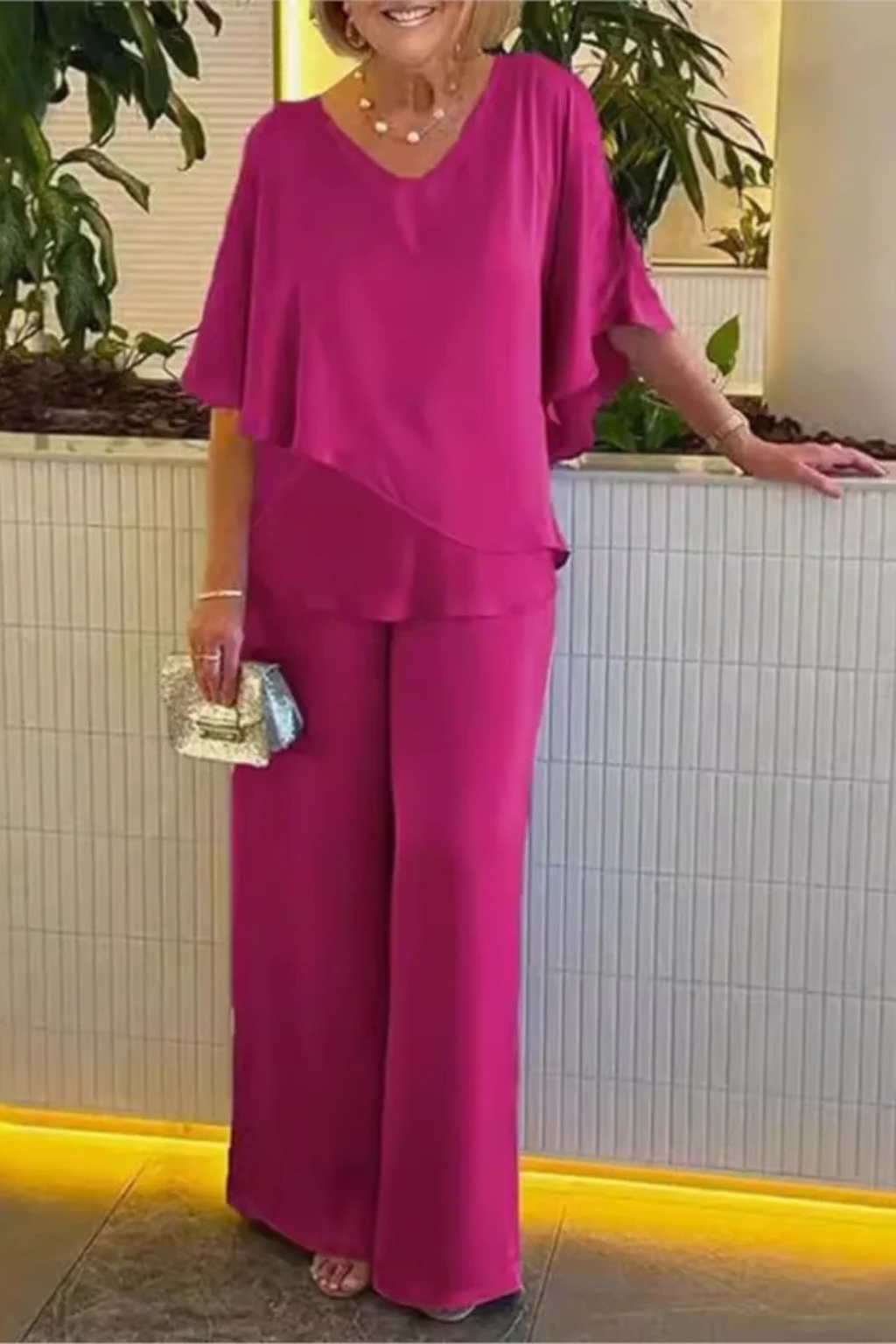 Women's casual elegant two-piece set with a modern top & flowing wide leg pants.