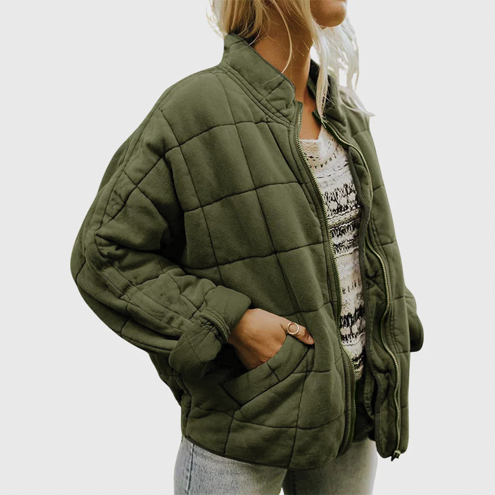 Women's cozy quilted zip jacket in green, stylish fall & winter outerwear, perfect for casual wear.