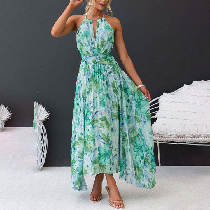 Woman wearing a beautiful green floral maxi dress, perfect for a breezy summer day, beach or elegant evening.