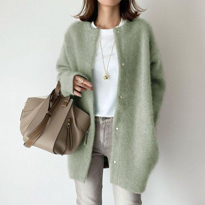 Elegant women's longline button cardigan, a timeless minimalist design for comfortable autumn outerwear.