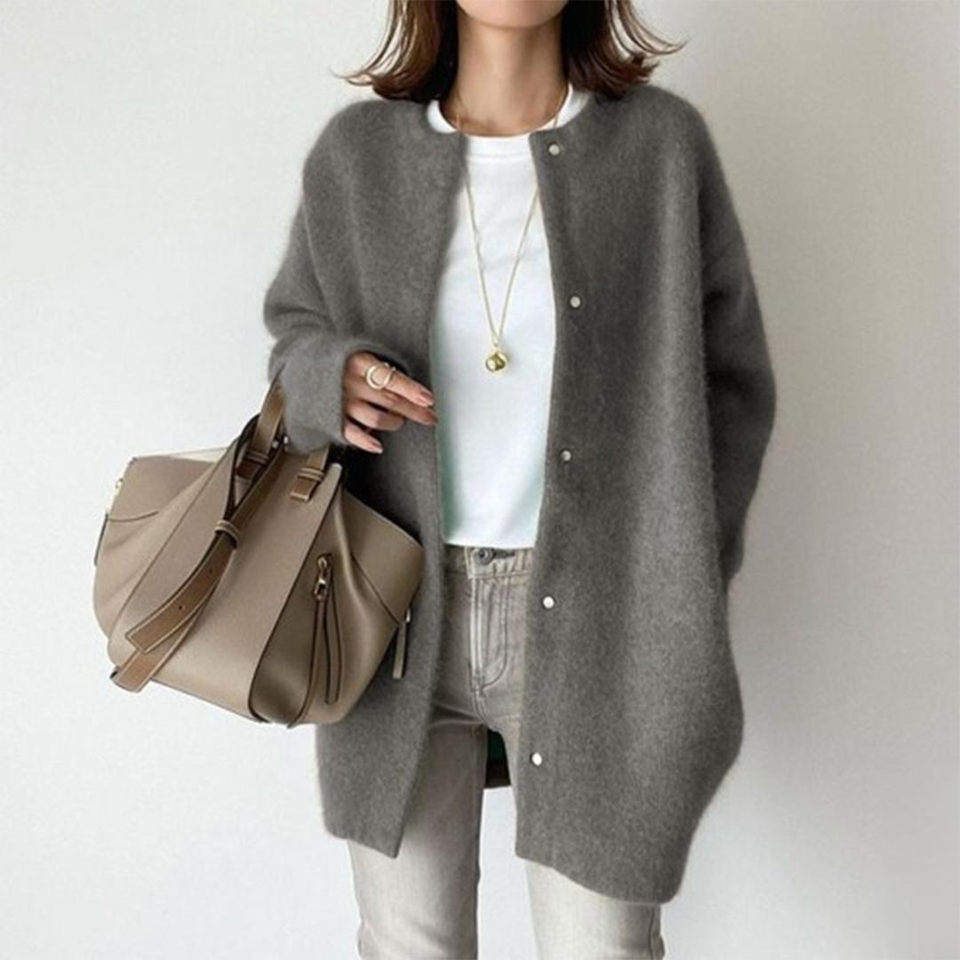 Versatile women's longline button cardigan, chic minimalist design ideal for elegant autumn layering.