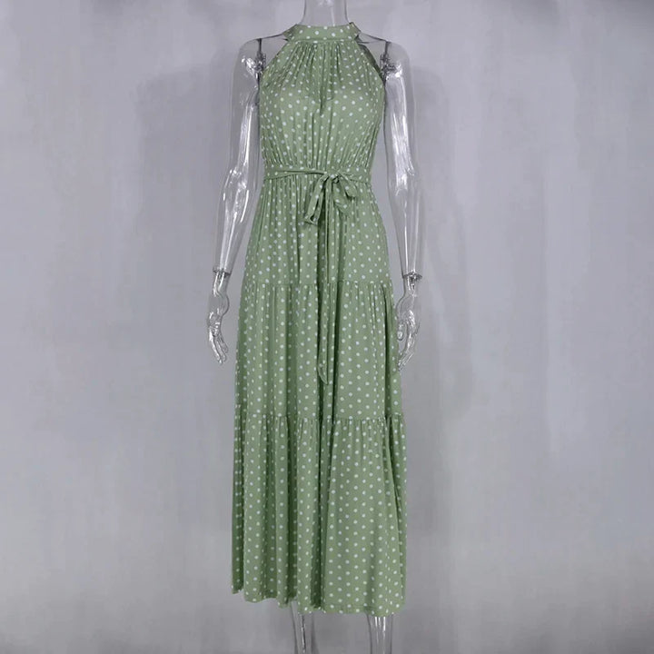 Flowy women's polka dot summer dress, perfect for vacation.
