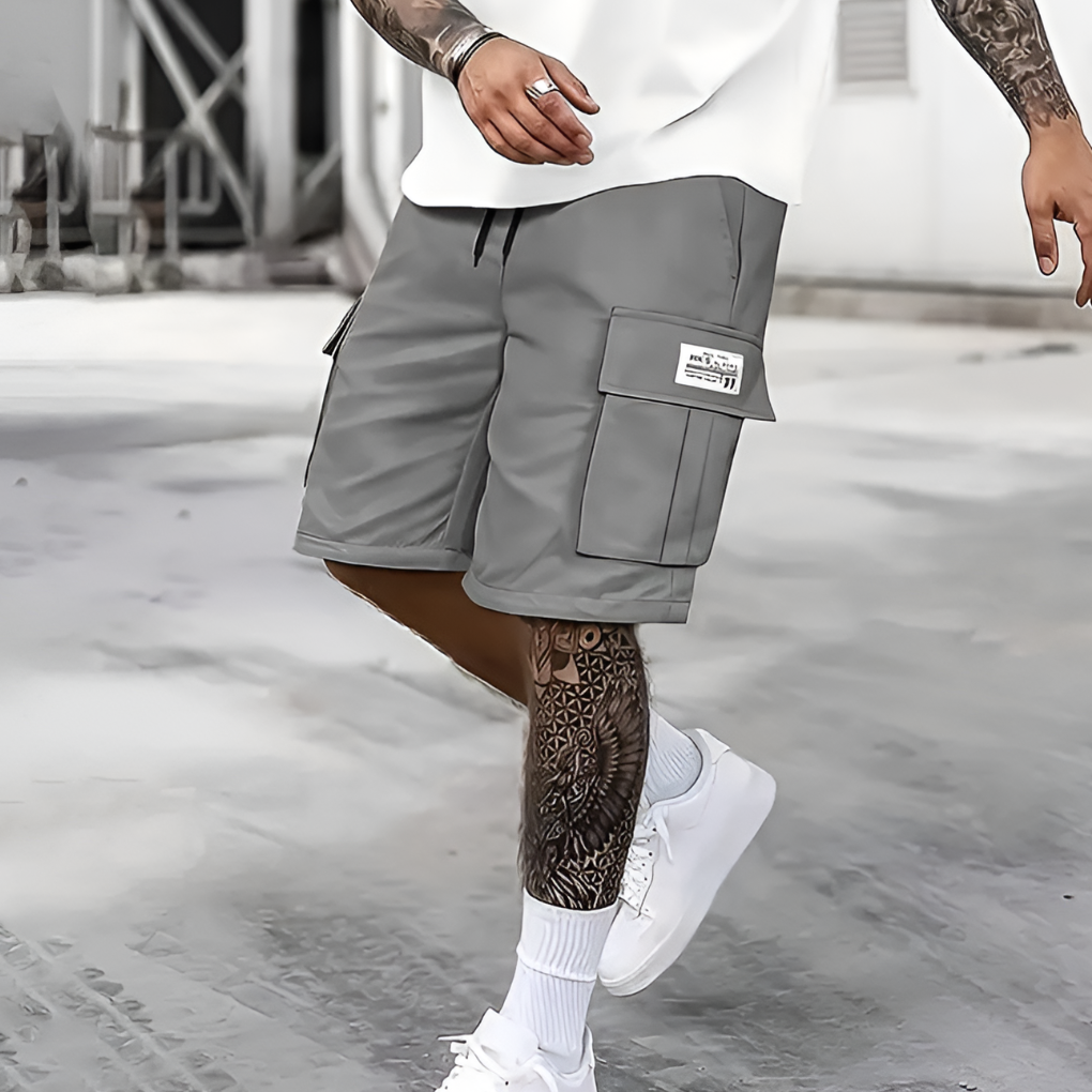 Men's loose fit cargo shorts for summer. Comfortable, knee-length casual wear with elastic waist, perfect for streetwear.