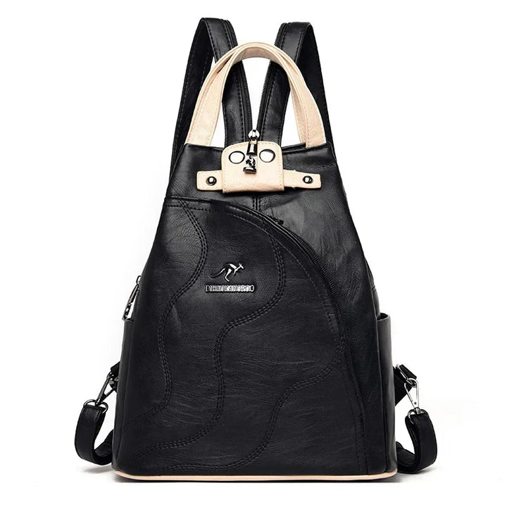 Women's anti-theft leather backpack showcasing a secure rear-access zipper, ideal for stylish, safe travel.