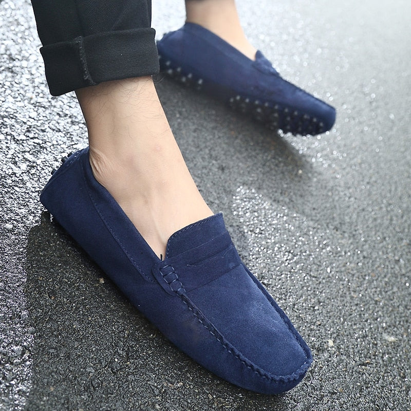Comfortable blue suede men's slip-on casual shoes, ideal for leisure and style.