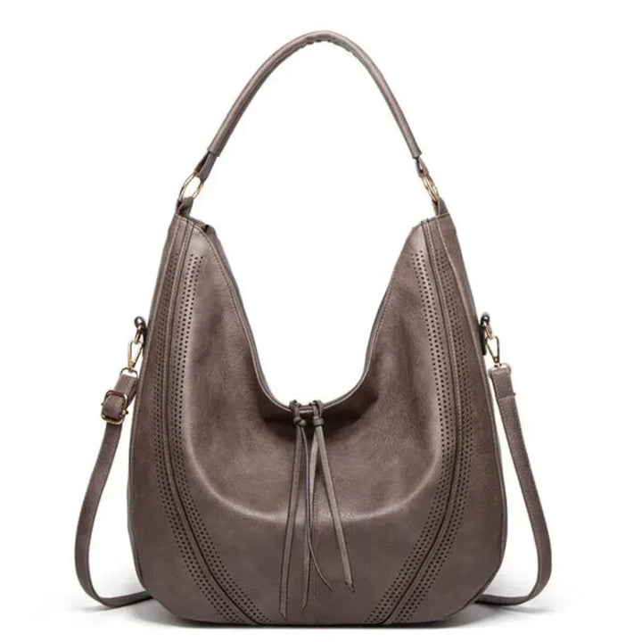 Women's classic vintage brown leather shoulder bag with adjustable strap, perfect for everyday elegance.