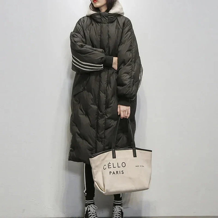 Stylish women's elegant puffer coat with hood, designed for cold weather fashion and comfort.