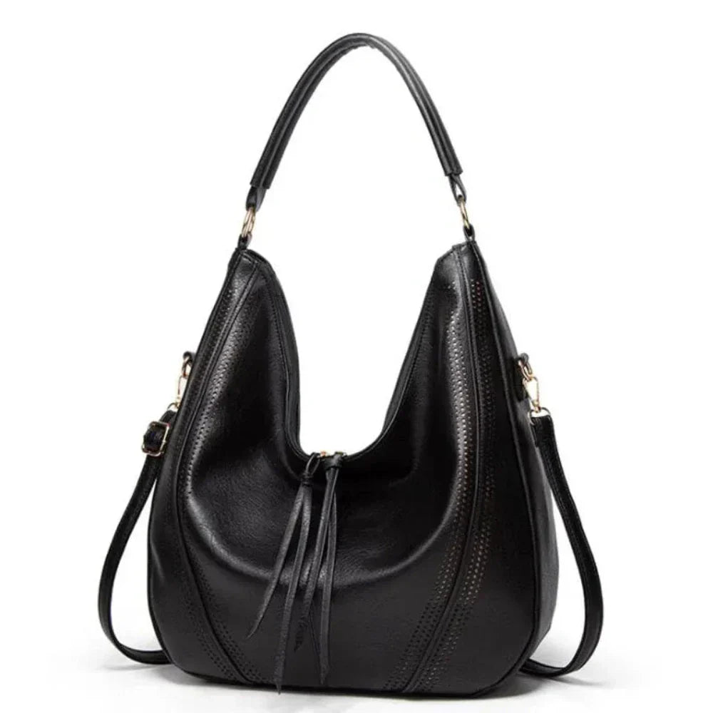Elegant women's brown vintage leather shoulder bag, featuring sturdy brass hardware & a secure flap closure.