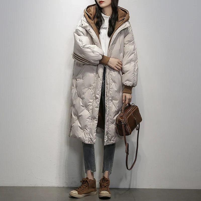 Elegant women's hooded puffer jacket, a warm winter coat for stylish cold weather outerwear.