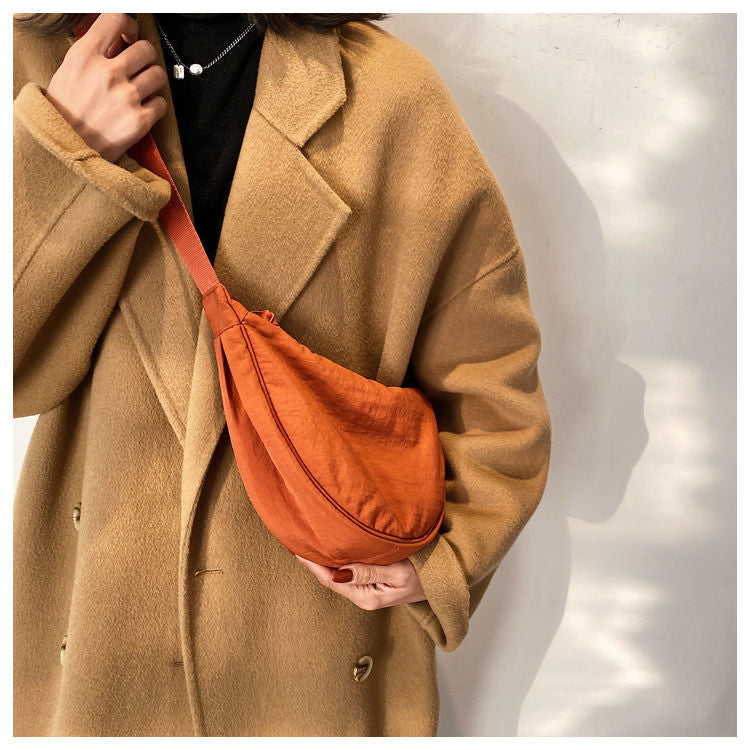 Fashionable Tan Half Moon Crossbody Bag, women's versatile purse complementing many styles.