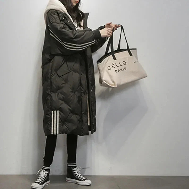 Sophisticated women's hooded puffer jacket, a warm and elegant winter coat for cold weather style.