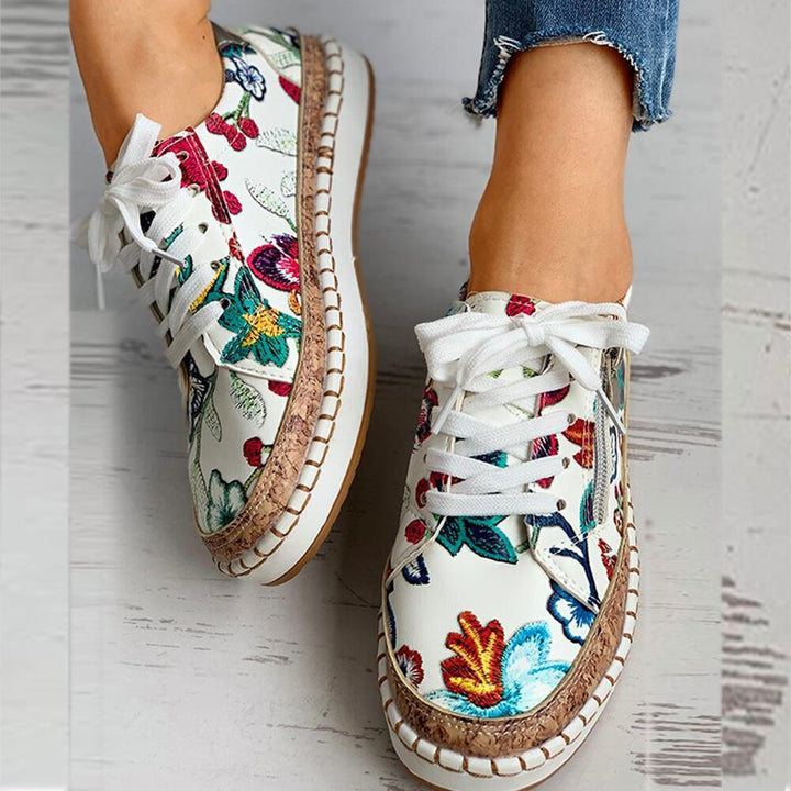 Breathable women's walking shoes with ergonomic design & elegant floral pattern, ensuring maximum foot comfort.