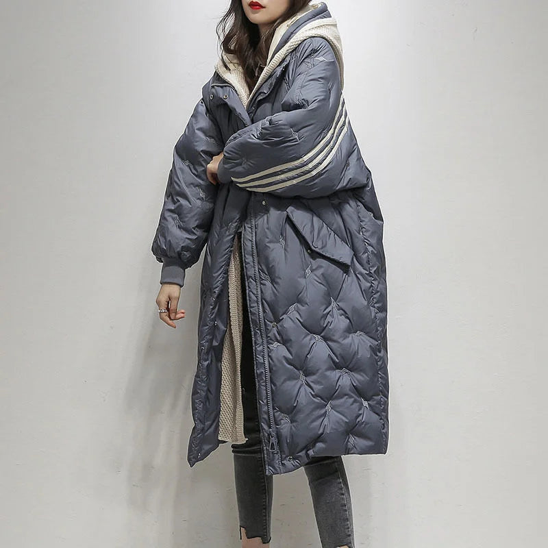 Chic women's winter puffer coat with a hood, offering warm, elegant outerwear for cold weather.