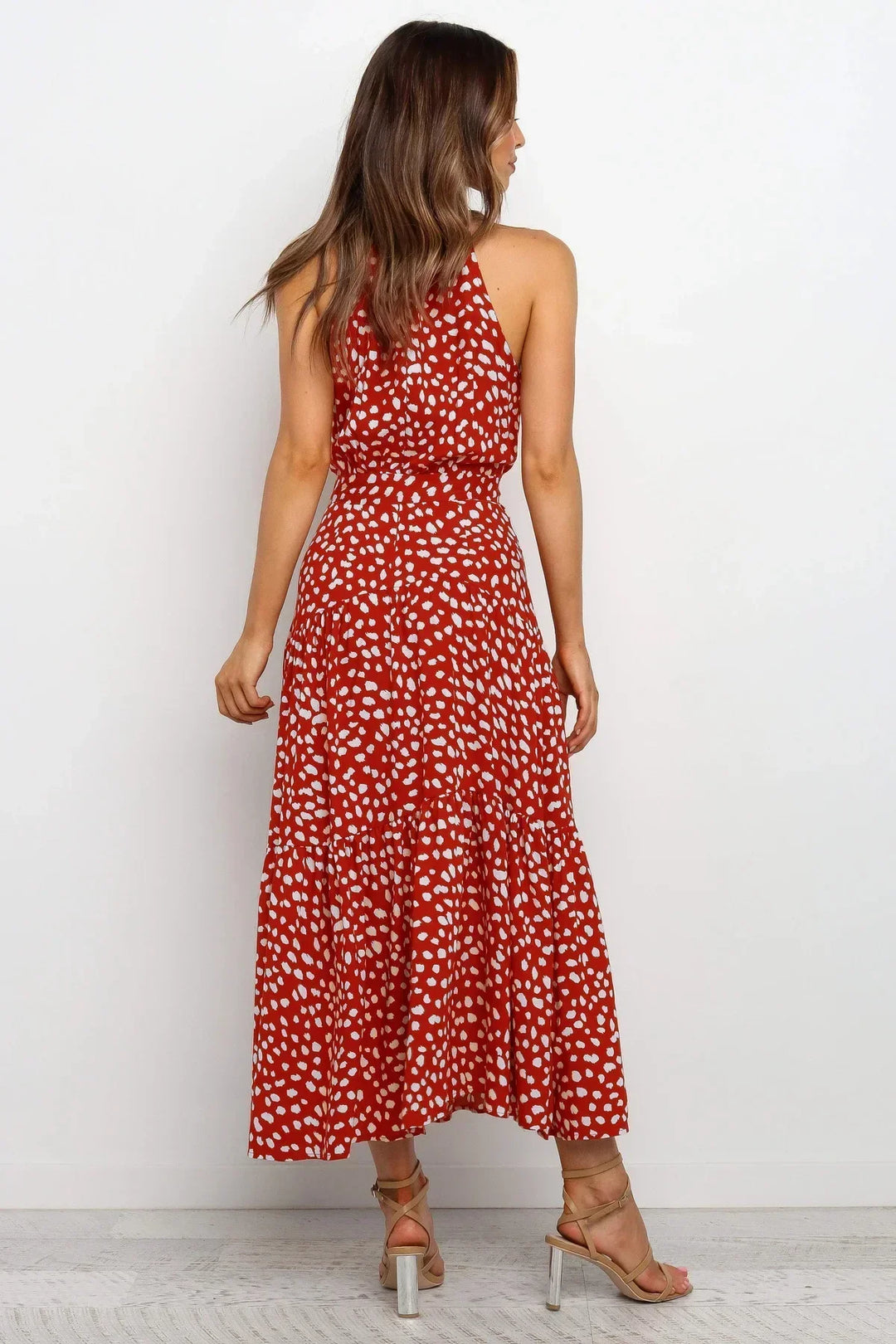 Flowy elegant polka dot summer dress, perfect for women's casual wear.