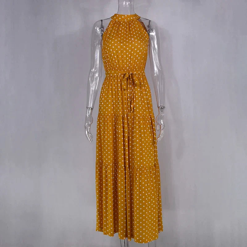Beach-ready women's polka dot flowy maxi dress for summer.