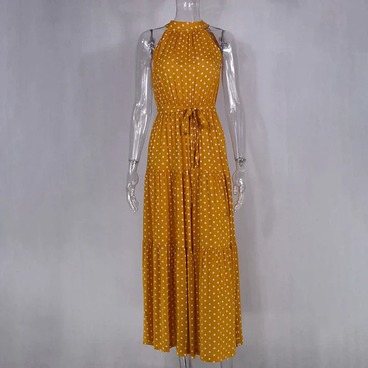 Beach-ready women's polka dot flowy maxi dress for summer.