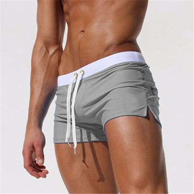 Striped men's quick-dry swim shorts, elastic comfort waistband, stylish for beach & resort.