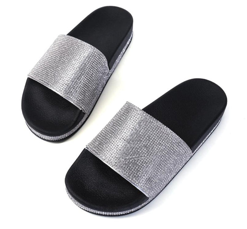 Women's designer slides, featuring glittering crystal embellishments & comfort.