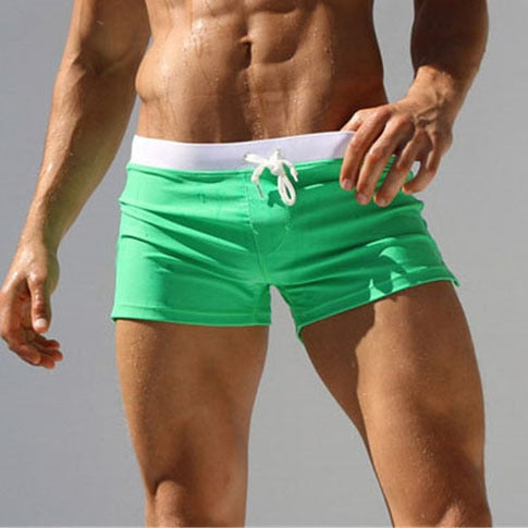 Men's comfort fit swim shorts, modern design & quick-dry material, ideal for resort wear.