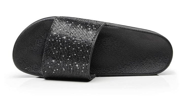 Women's casual slides featuring sparkling crystal detailing, stylish summer wear.