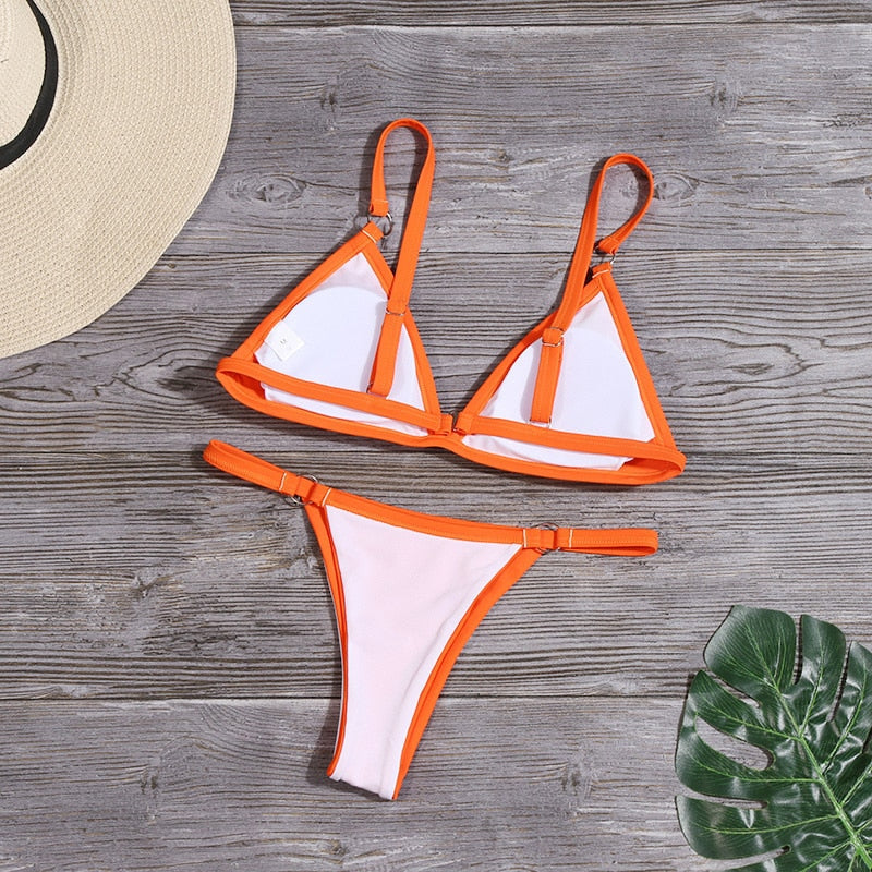 Radiant women's bikini swimsuit with elegant ring details, perfect for summer beachwear.