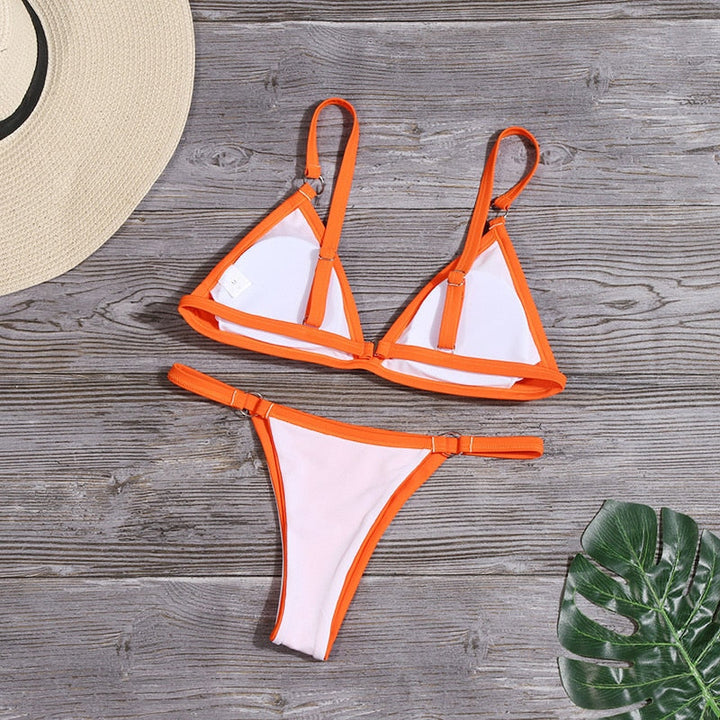 Radiant women's bikini swimsuit with elegant ring details, perfect for summer beachwear.