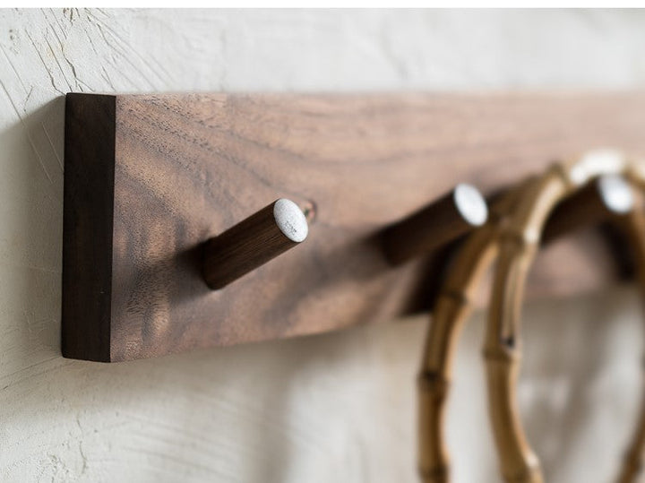 Zen minimalist wooden wall coat rack, handmade for stylish entryway organization.