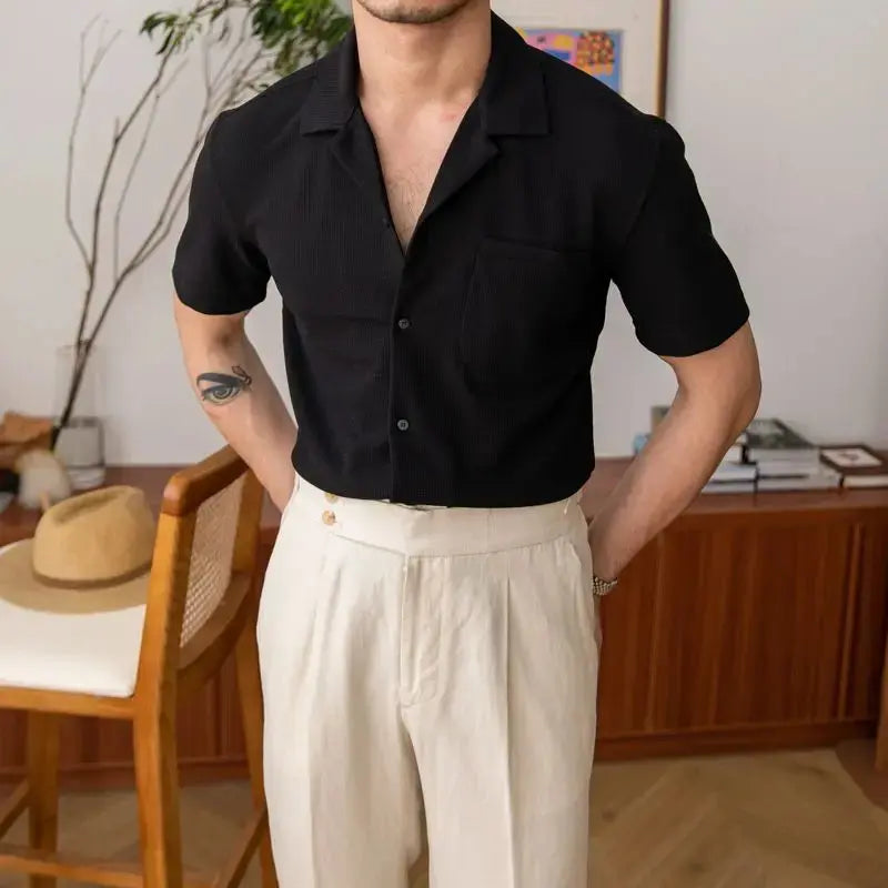 Close-up of textured men's short sleeve shirt fabric. Open collar design, perfect for a breathable summer top.